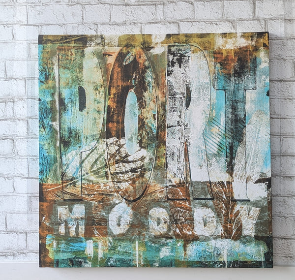 A GICLEE CANVAS PRINT featuring text and abstract elements in a vibrant mix of browns, greens and leaf imprint, with the text 'Port Moody' prominent in the composition.